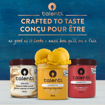 Talenti Alphonso Mango gelato pint beside spoon and sliced mango on tabletop