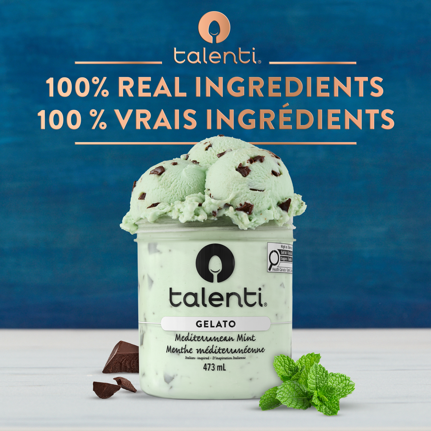 Bowl of Talenti Mediterranean Mint gelato with chocolate flecks and fresh mint leaves