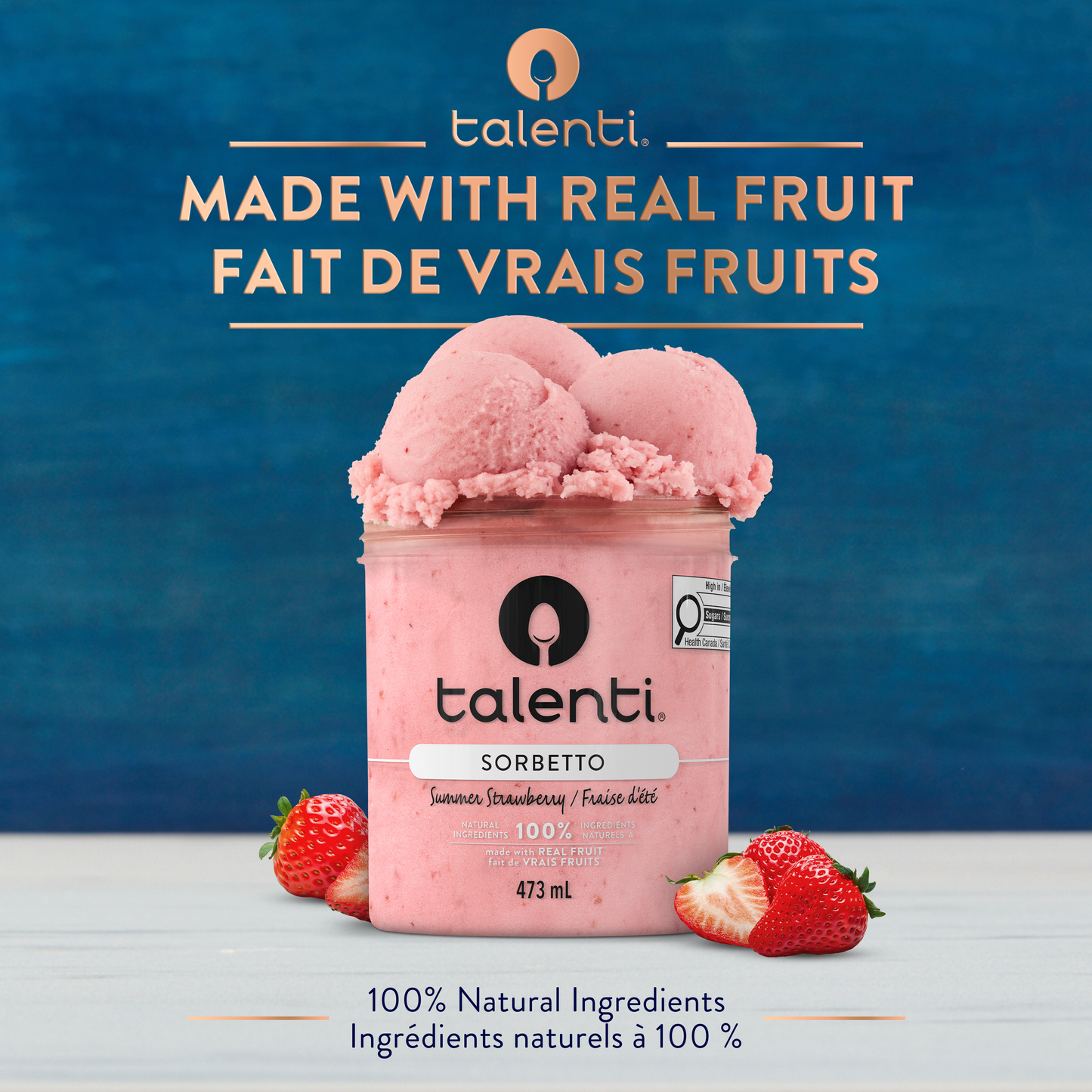Scoop of Talenti Summer Strawberry Sorbetto in bowl with fresh strawberry pieces